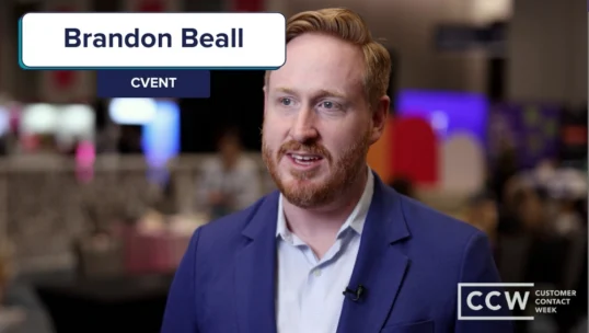 A man in a blue blazer speaks at an event. Text on screen reads "Brandon Beall, Cvent" and "CCW Customer Contact Week." The background is blurred.