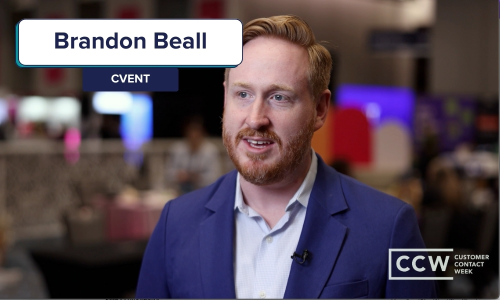 A man in a blue blazer speaks at an event. Text on screen reads "Brandon Beall, Cvent" and "CCW Customer Contact Week." The background is blurred.