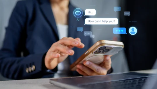 Businesswoman using smartphone with AI chatbot assistant, customer service online support concept