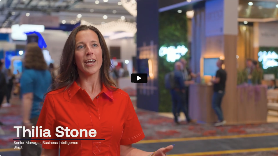 A woman in a red shirt speaks at a conference, with booths and attendees visible in the background. Text on screen reads: “Thilia Stone, Senior Manager, Business Intelligence, Shipt.”.